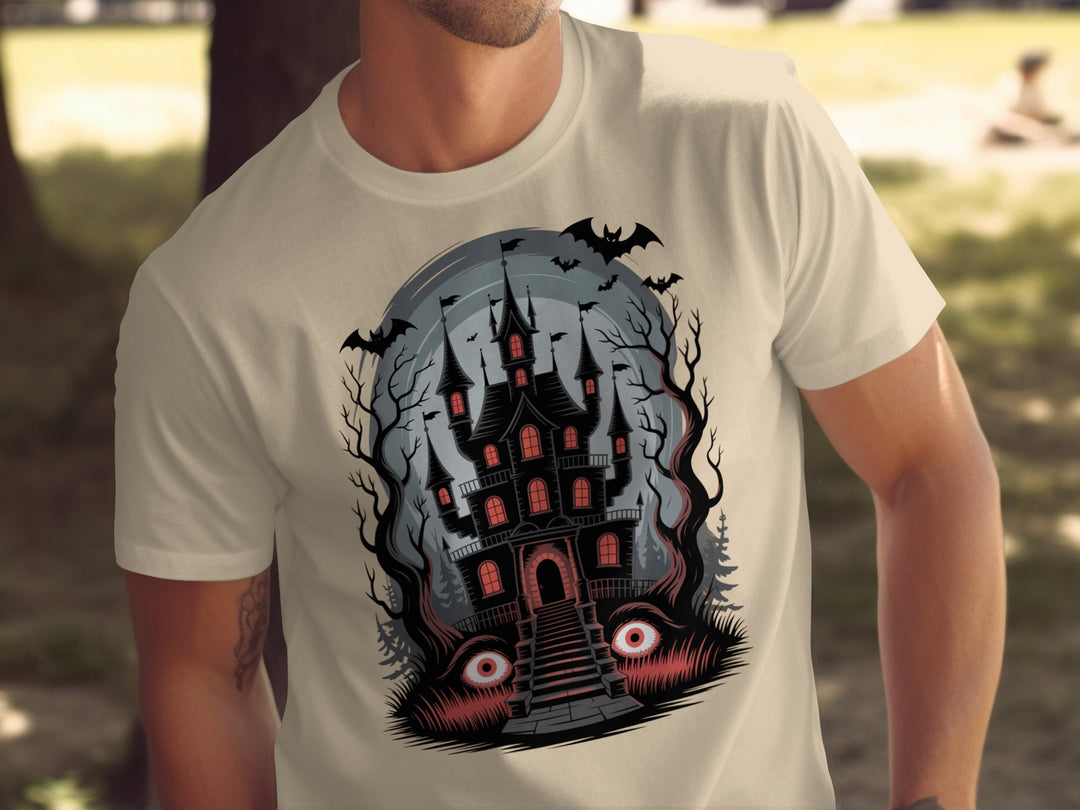 Halloween T-shirt for men with haunted mansion, red windows, bats and eerie eyes graphic