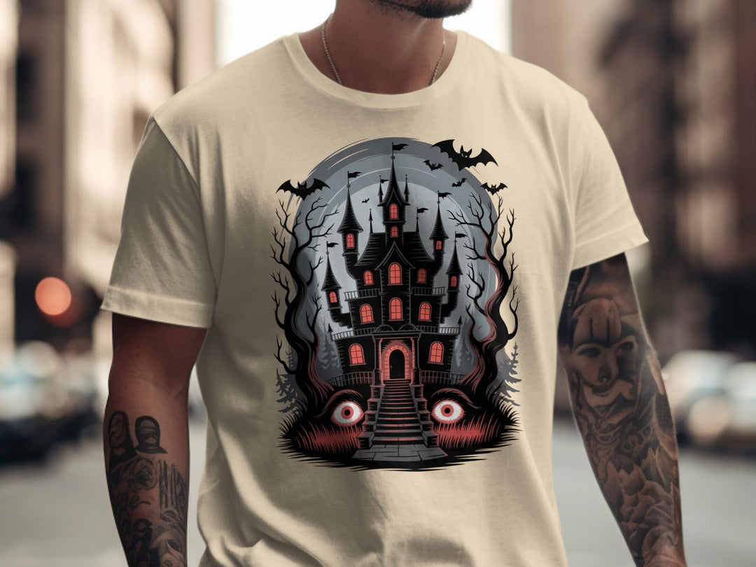 Halloween T-shirt for men with haunted mansion, red windows, bats and eerie eyes graphic
