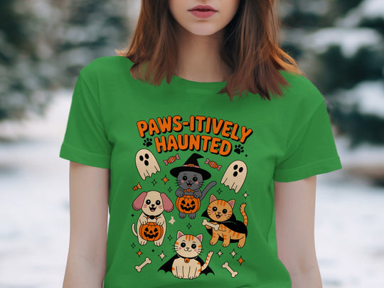 Women’s Halloween T-shirt with “Paws-itively Haunted” cats, dog, pumpkins and ghosts graphic