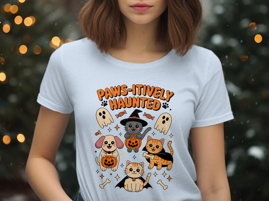 Women’s Halloween T-shirt with “Paws-itively Haunted” cats, dog, pumpkins and ghosts graphic