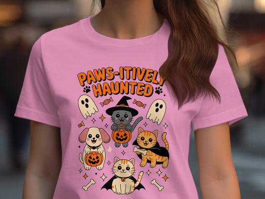 Women’s Halloween T-shirt with “Paws-itively Haunted” cats, dog, pumpkins and ghosts graphic