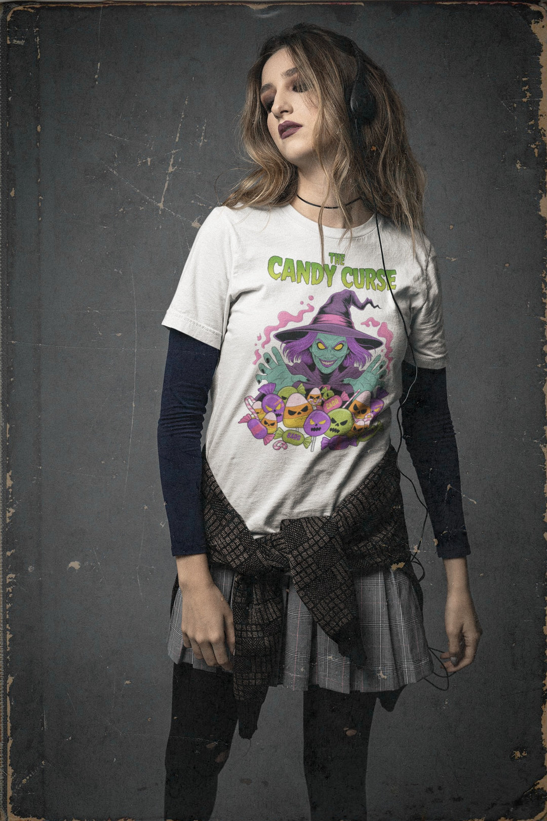 Woman wearing a t-shirt with a colorful graphic design on a dark background