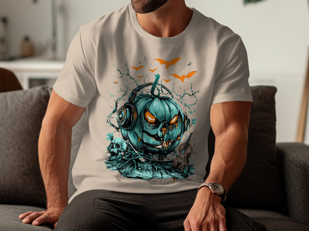 Person wearing a sand color t-shirt with a teal pumpkin graphic design.