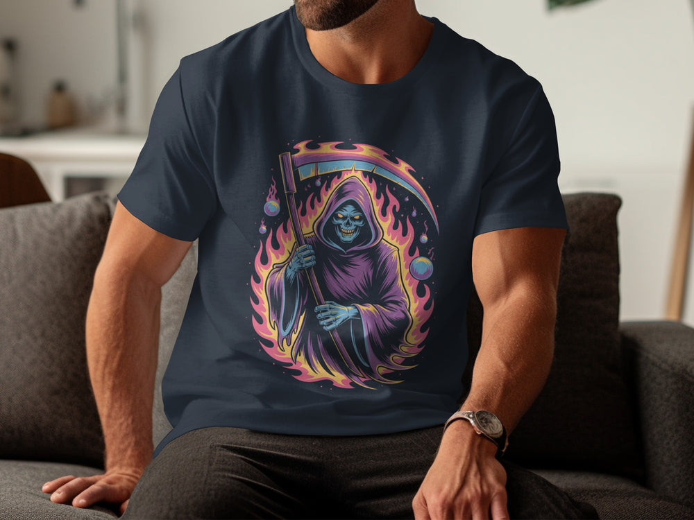 Person wearing a navy blue t-shirt with a colorful graphic design of a reaper sitting on a couch.