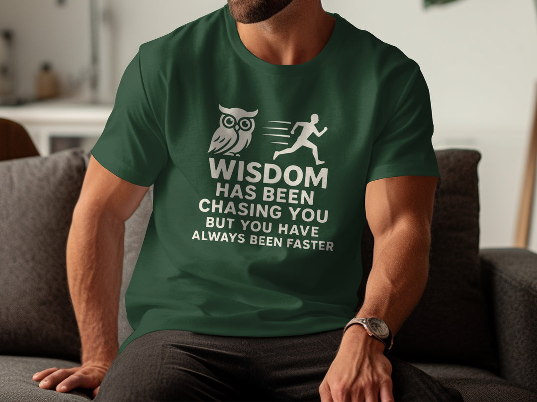 Person wearing a green t-shirt with a motivational quote and owl and runner graphic.