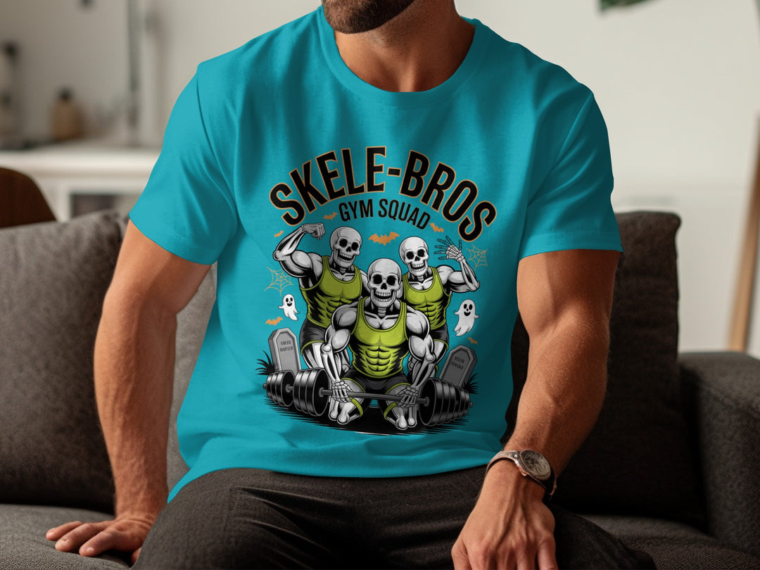 Person wearing a blue t-shirt with 'Skele-Bros Gym Squad' design sitting on a couch.