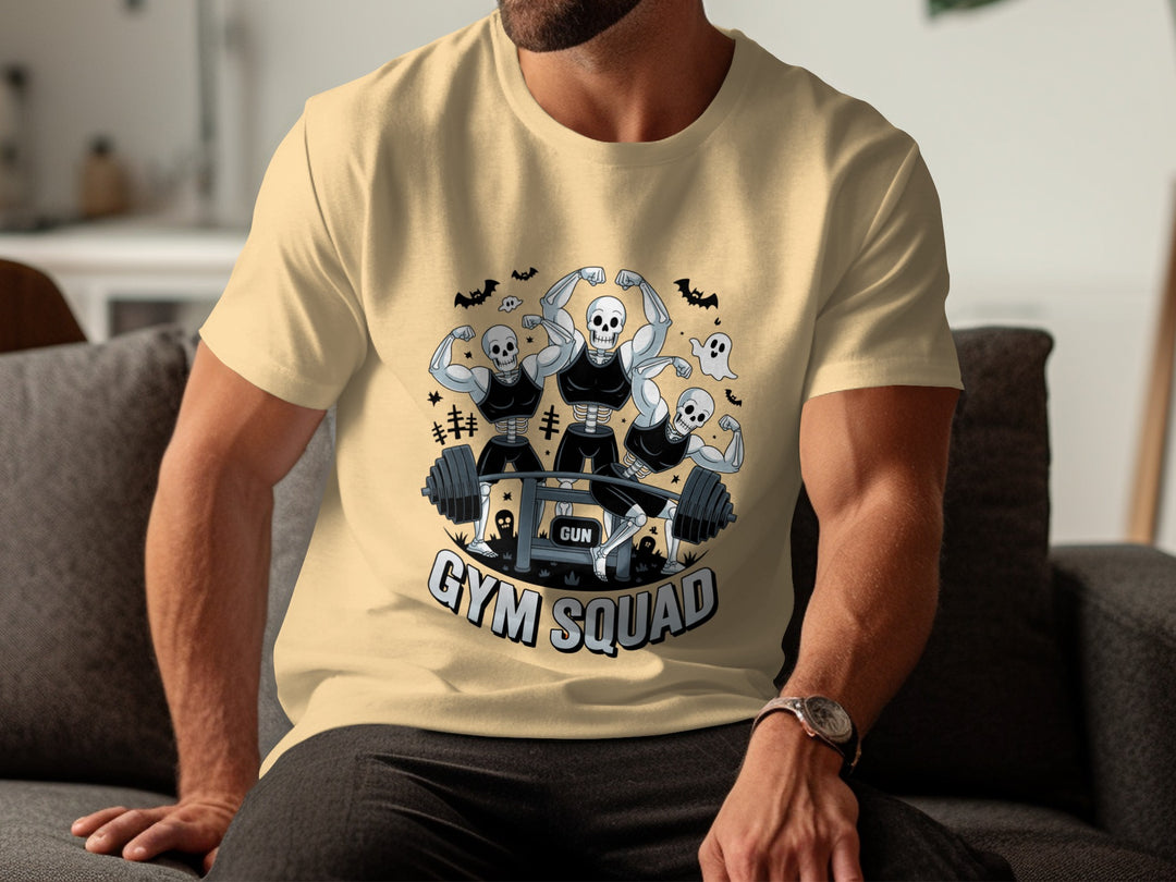 Person wearing a yellow haze t-shirt with 'Gym Squad' graphic design sitting on a couch.
