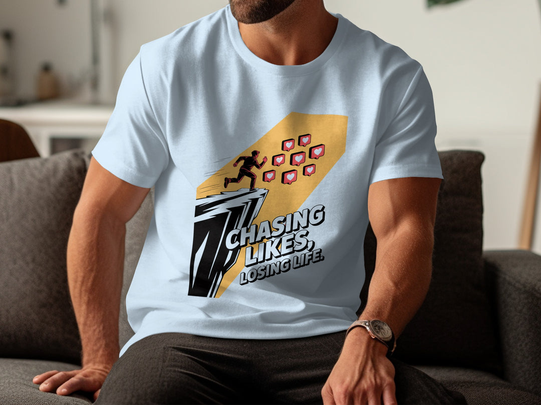 Person wearing a light blue t-shirt with a graphic design and text.