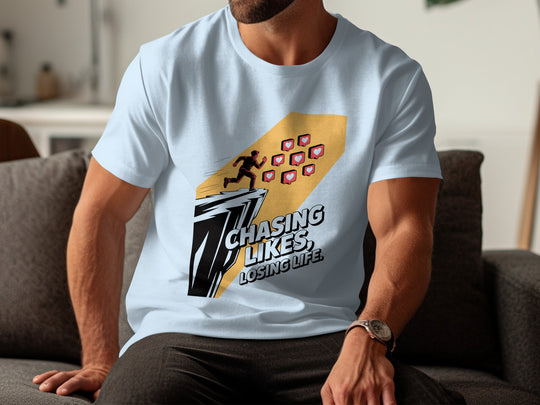 Person wearing a light blue t-shirt with a graphic design and text.