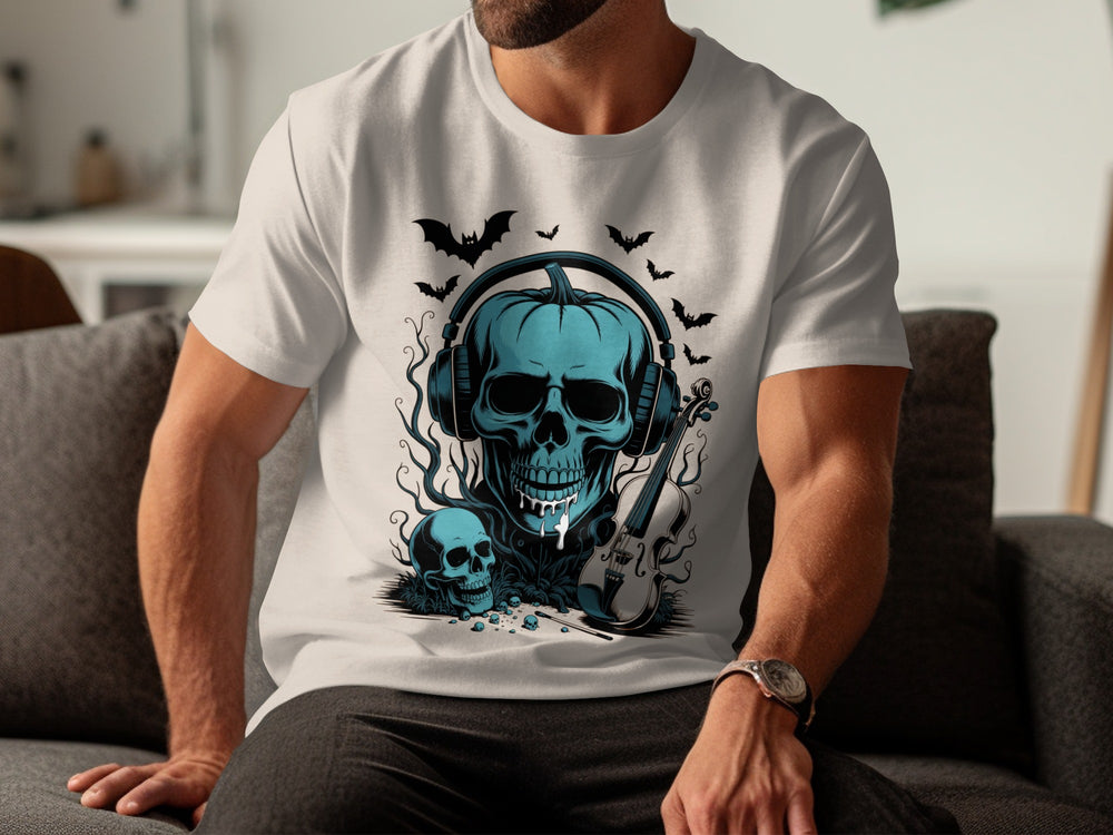 Person wearing a natural color t-shirt with a blue skull design sitting on a couch.