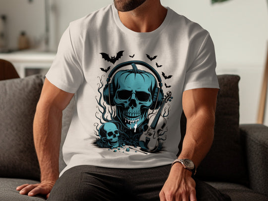 Person wearing a natural color t-shirt with a blue skull design sitting on a couch.