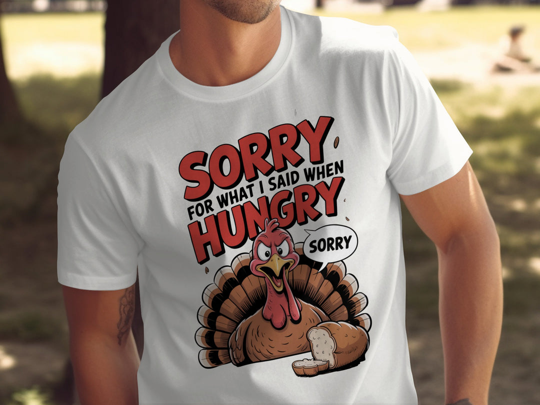 Person wearing white t-shirt with a cartoon turkey graphic and text in an urban setting.