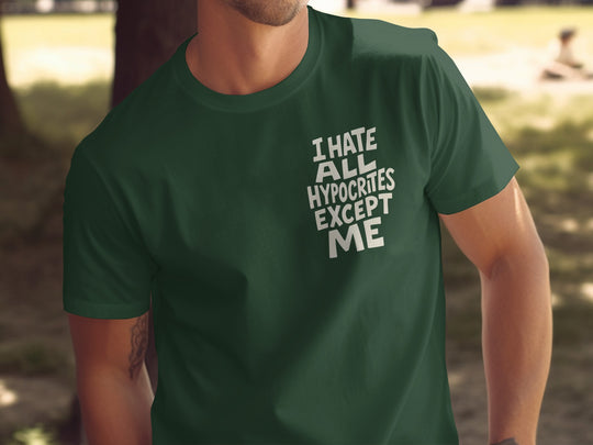 Person wearing a green t-shirt with text outdoors