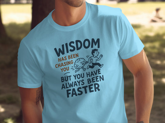 funny men's t-shirt with “wisdom has been chasing you” quote graphic