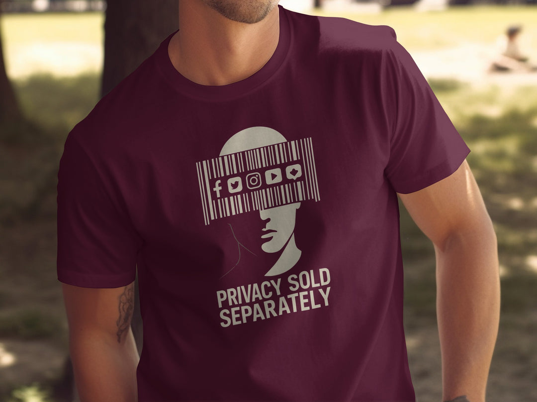 Person wearing a maroon t-shirt with a graphic design and text.