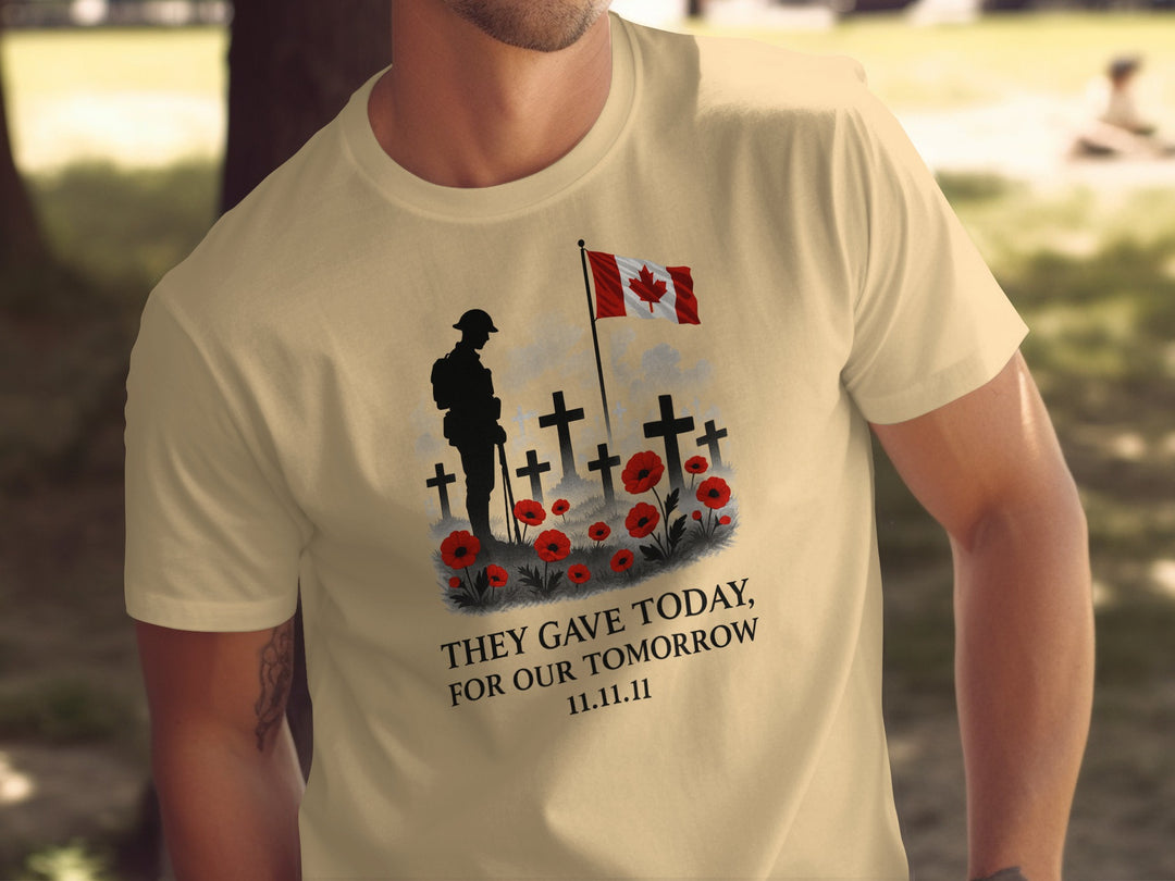 Person wearing a yellow haze t-shirt with a military-themed design featuring crosses, a flag, and text.