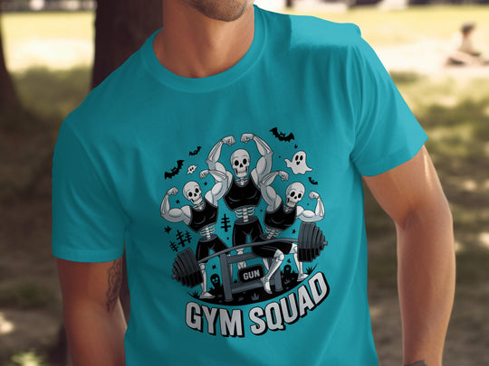Person wearing a turquoise t-shirt with 'Gym Squad' graphic design.