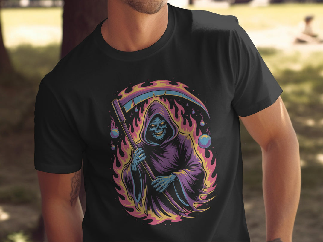 Black t-shirt with a colorful graphic of a skeleton in a robe and staff, set against a blurred outdoor background.