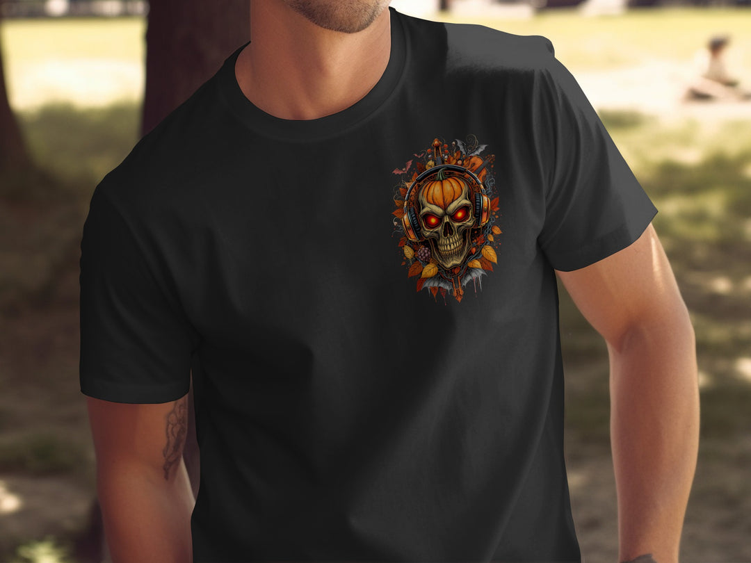 Black t-shirt with a graphic design of a skull and pumpkin on a blurred outdoor background