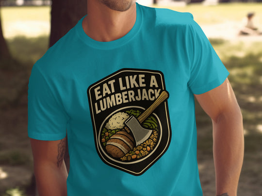 Person wearing a turquoise t-shirt with a 'Eat Like a Lumberjack' graphic design.
