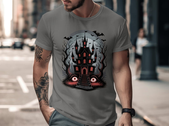 Person wearing a charcoal t-shirt with a castle design on a city street
