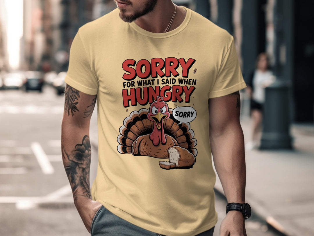 Person wearing yellow haze t-shirt with a cartoon turkey graphic and text in an urban setting.