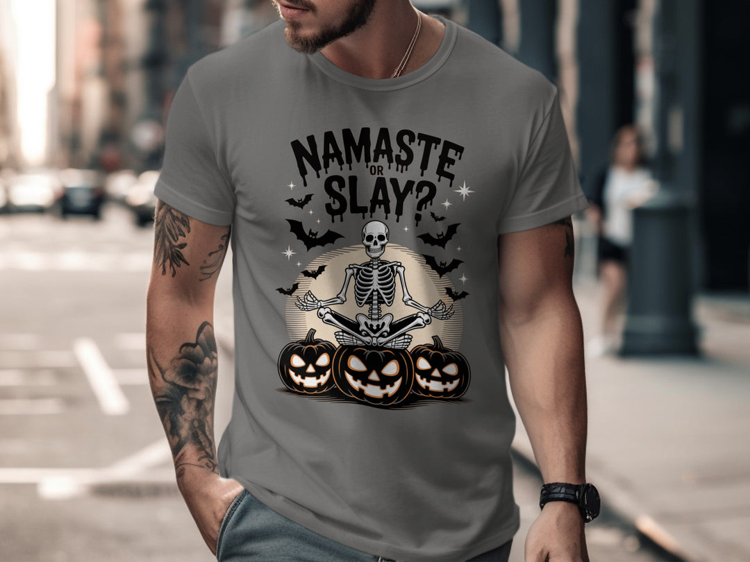 Man wearing a charcoal t-shirt with a Halloween-themed design on a city street.