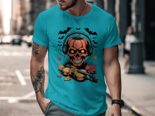 Person wearing a blue t-shirt with a graphic design of a skull with headphones, violin, and bats.