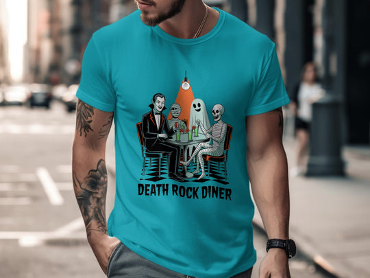 Person wearing a turquoise t-shirt with 'Death Rock Diner' graphic on a city street.