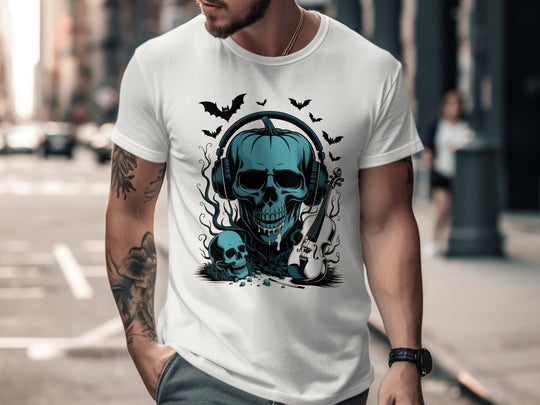 Person wearing a white t-shirt with a blue skull design on a city street.