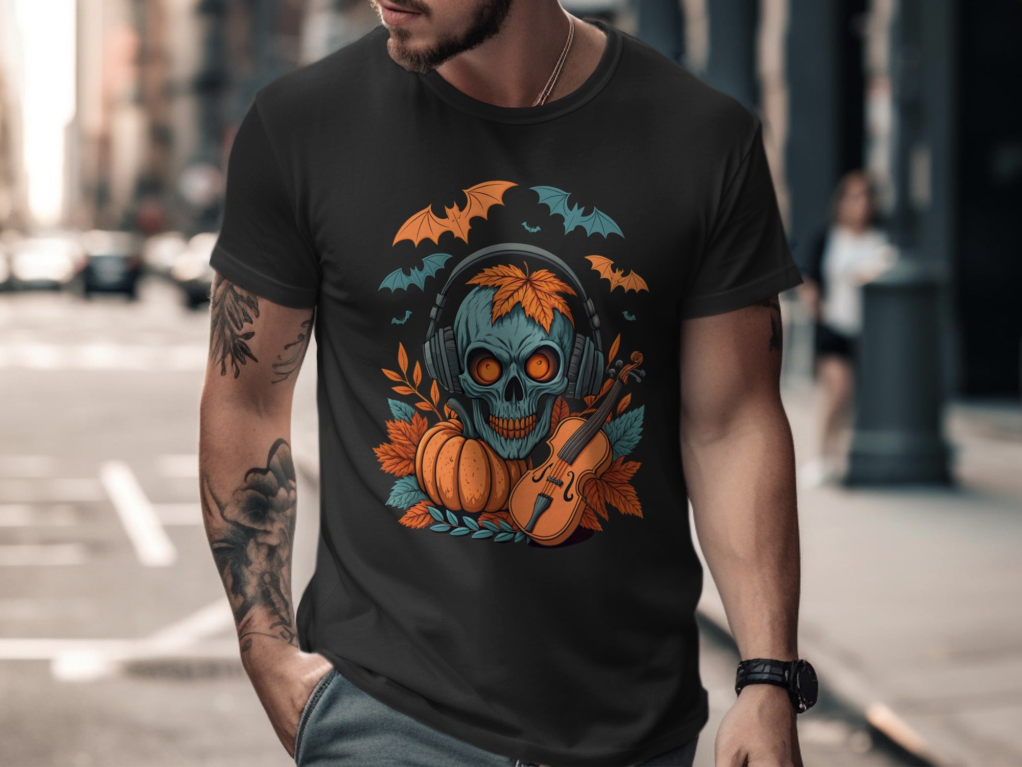 Man wearing a black t-shirt with a colorful graphic design on a city street.