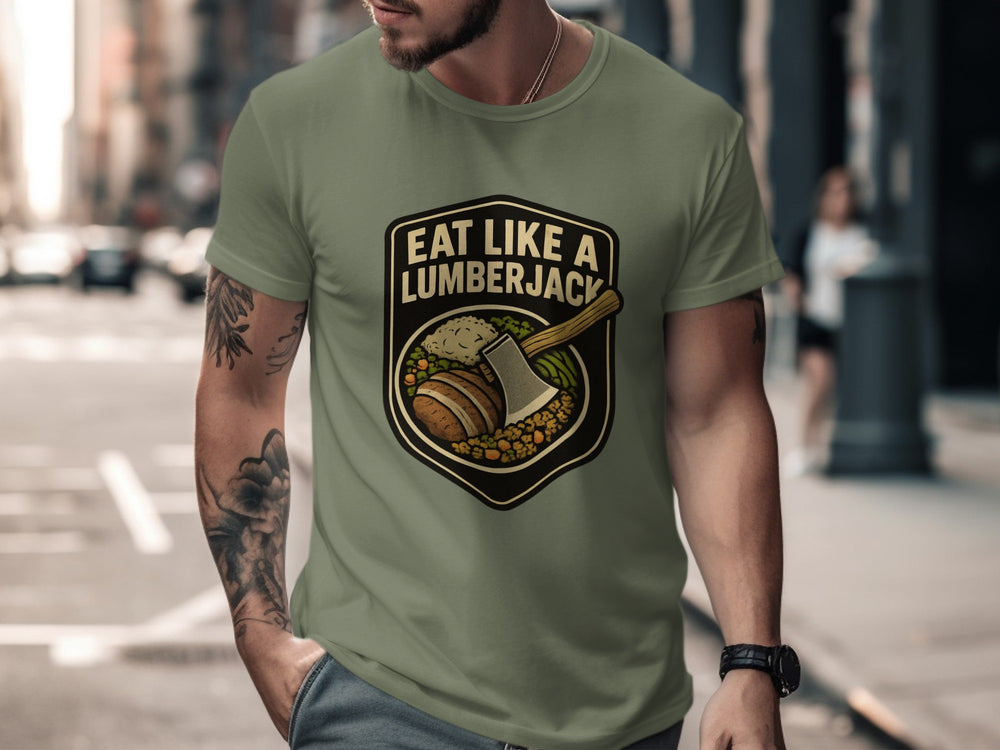 Man wearing a green t-shirt with 'Eat Like a Lumberjack' graphic on a city street.