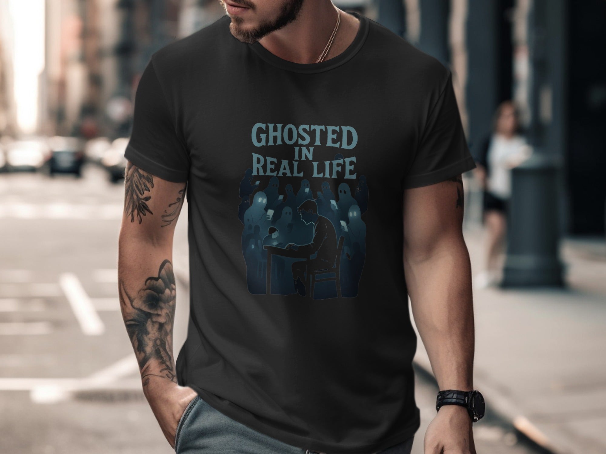 Man wearing a black t-shirt with 'Ghosted in Real Life' graphic on a city street.