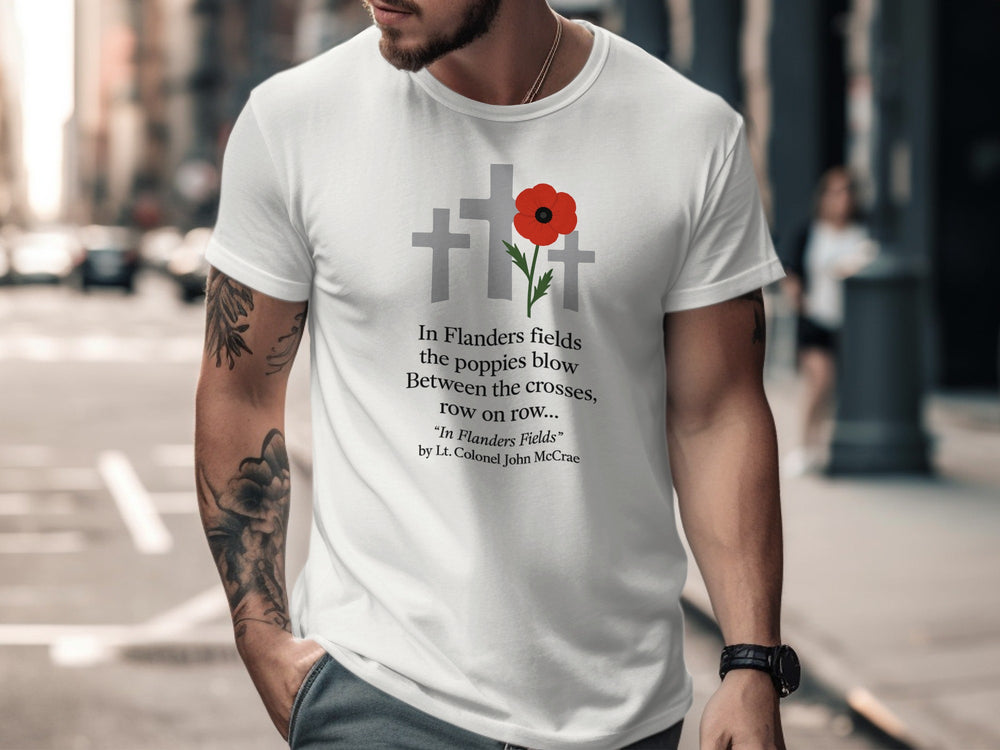 Man wearing a white t-shirt with a poppy design and text on a city street.