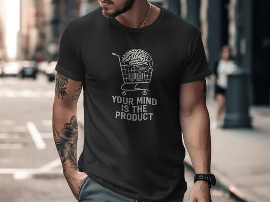 Man wearing a black t-shirt with a graphic and text on a city street.
