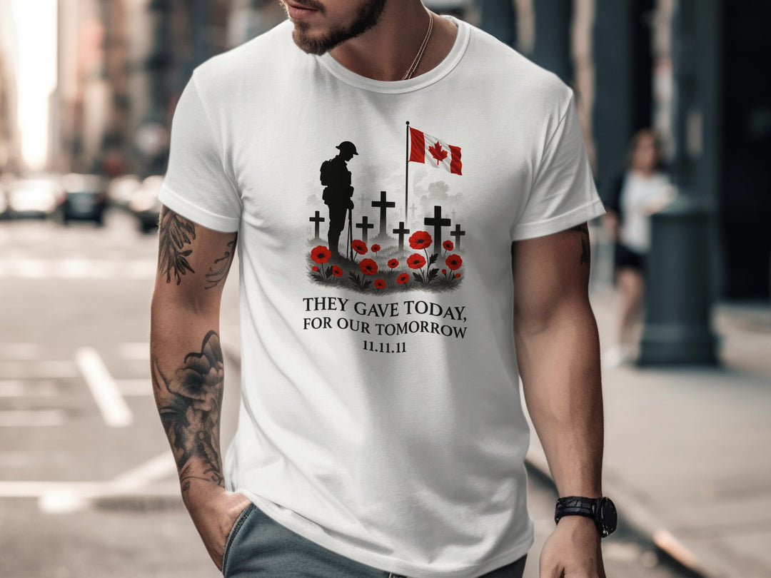 Man wearing a white t-shirt with a graphic design and text, standing on a city street.