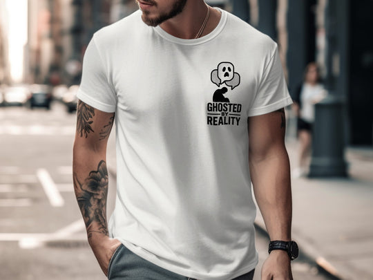 Man wearing a white t-shirt with a graphic design on a city street