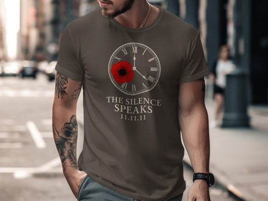 Man wearing a dark chocolate t-shirt with a clock design and text on a city street.