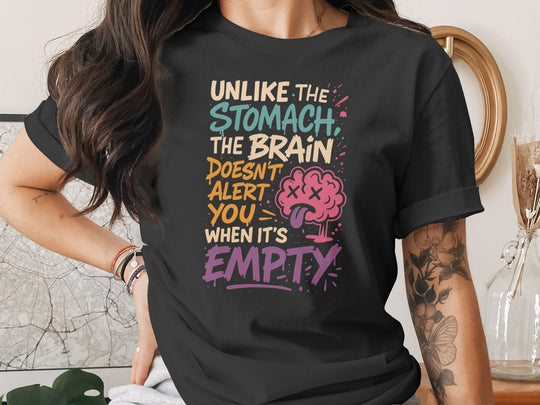 Person wearing a black t-shirt with colorful text and brain graphic.