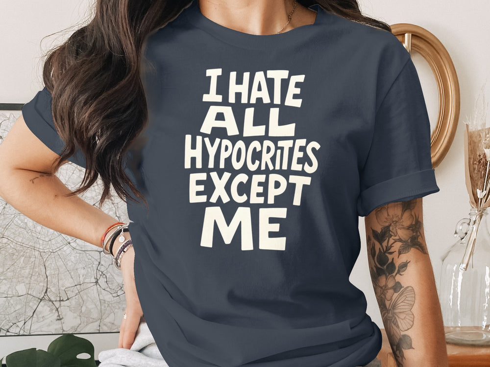 Person wearing a navy blue t-shirt with white text in a casual setting.