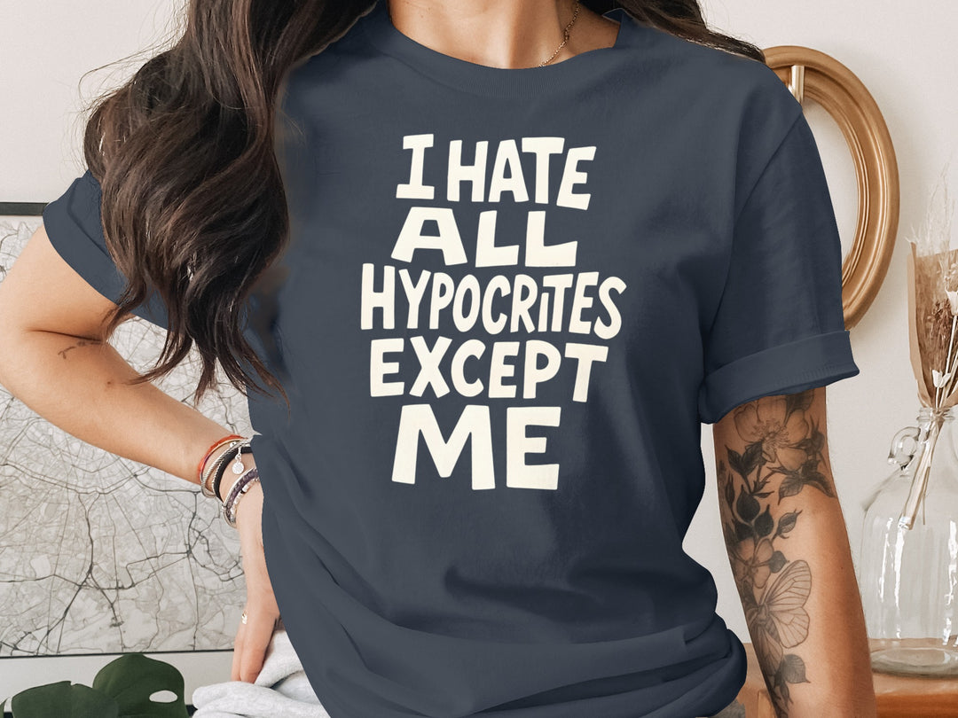 Person wearing a navy blue t-shirt with white text in a casual setting.