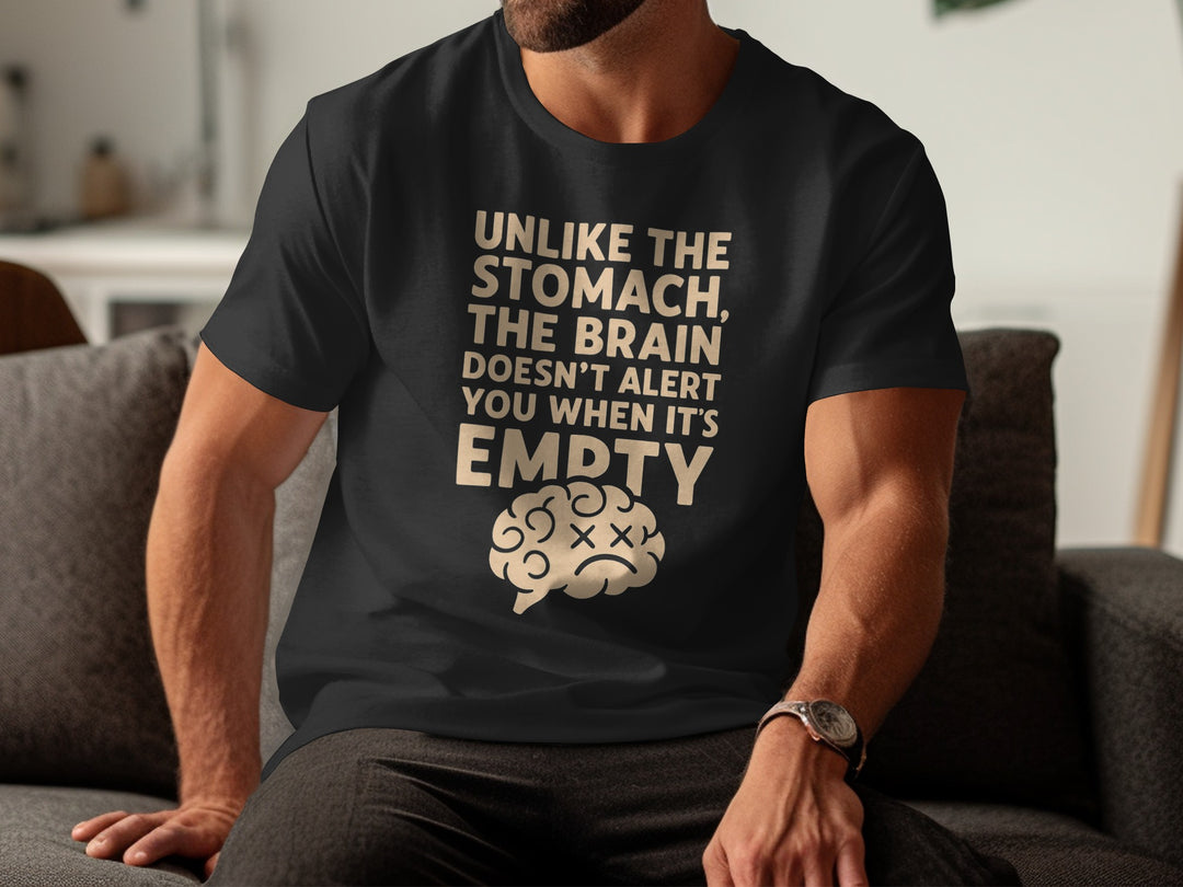 Person wearing a black t-shirt with a humorous graphic and text.
