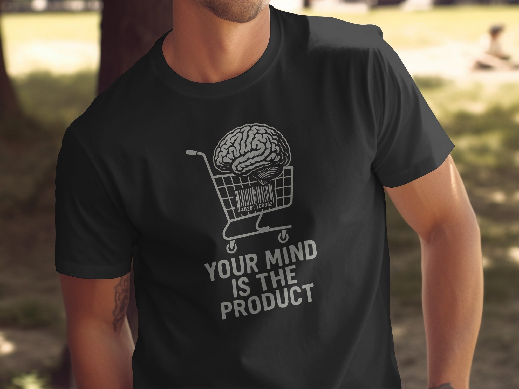 Person wearing a black t-shirt with a graphic design and text.