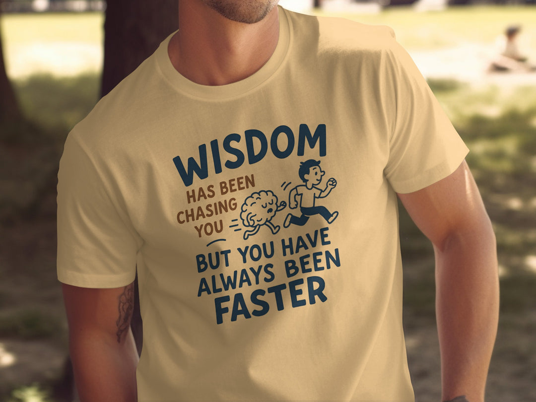 Person wearing a yellow t-shirt with a funny quote and graphic design.