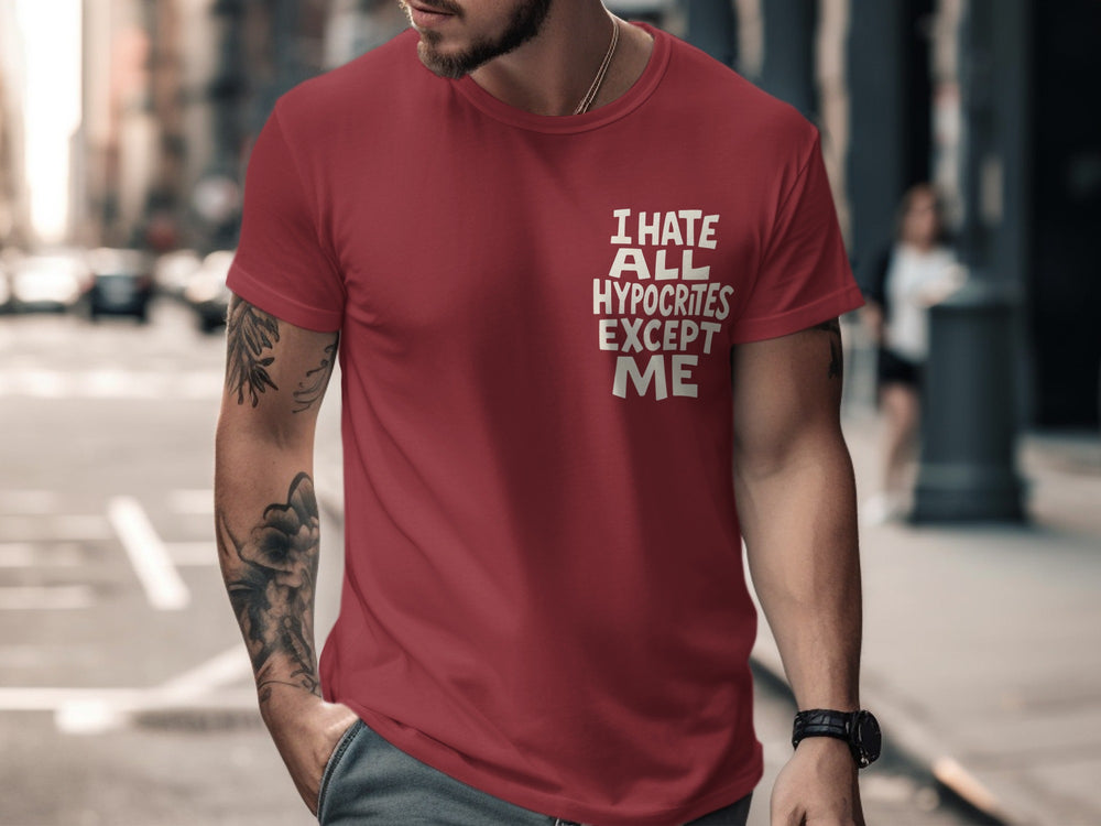 Man wearing a red t-shirt with text on a city street