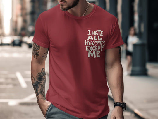 Man wearing a red t-shirt with text on a city street