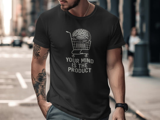 Man wearing a black t-shirt with a graphic and text on a city street.