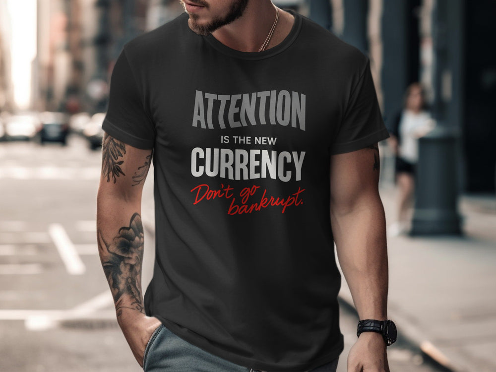 Man wearing a black t-shirt with text on a city street
