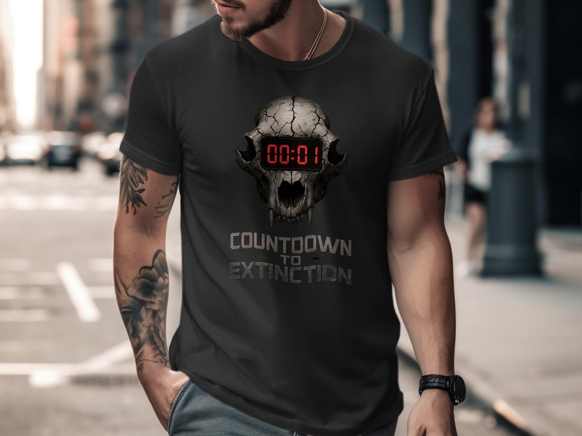 Man wearing a black t-shirt with a graphic design and text on a city street.