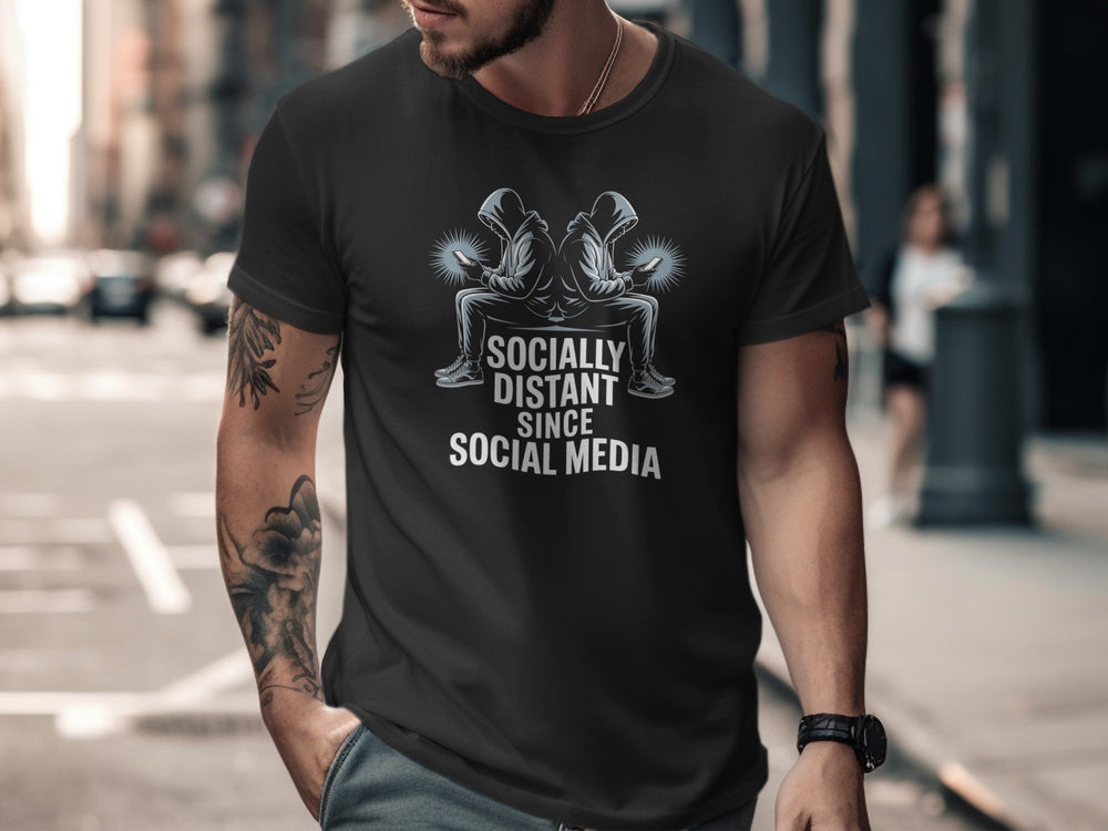 Man wearing a black t-shirt with a graphic design and text on a city street.